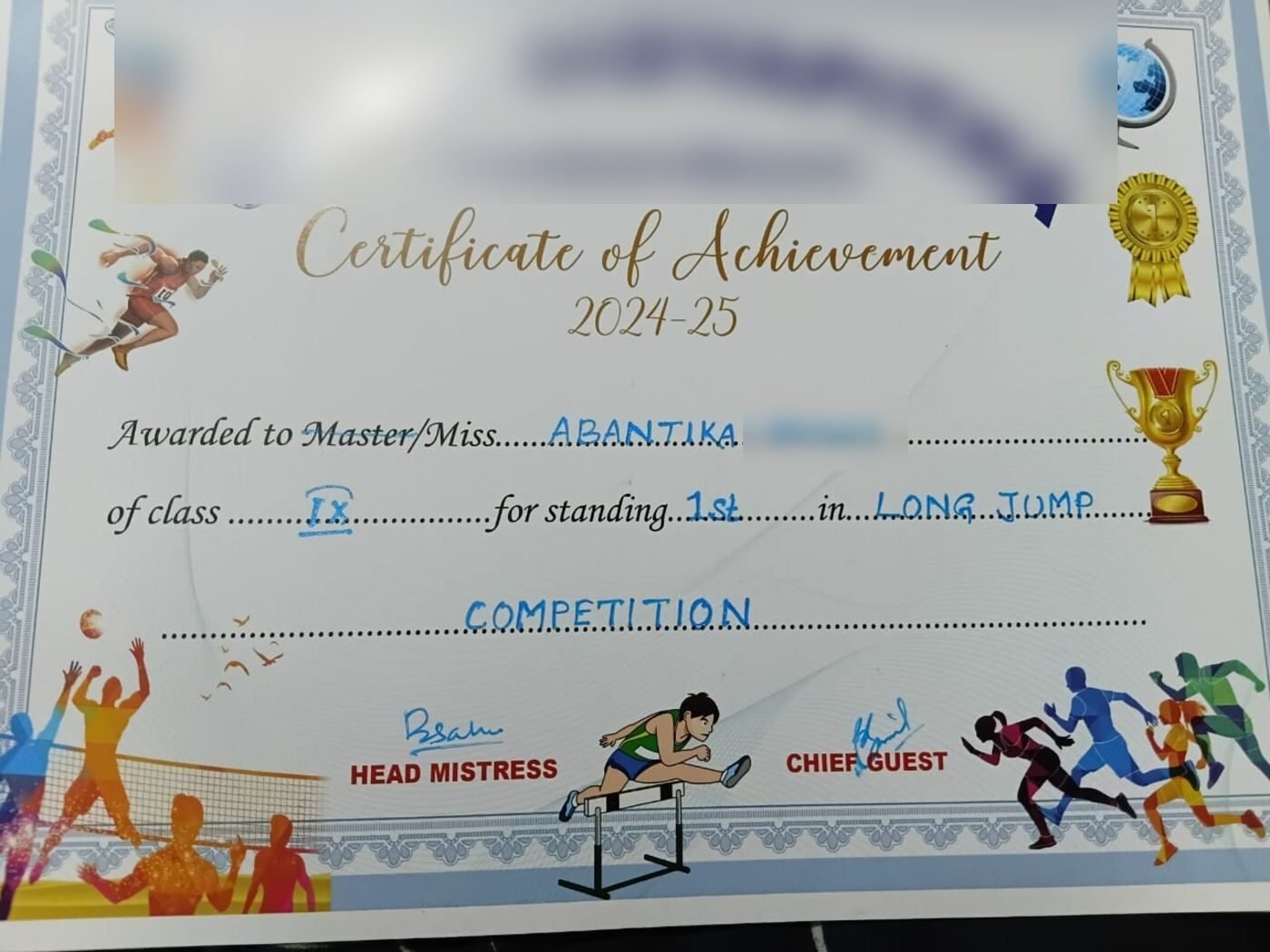 Certificate of Achievement awarding first place in the long jump competition, with the student's surname and school redacted.